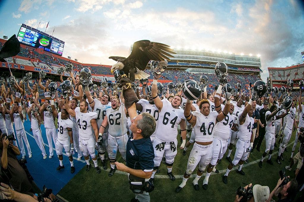 Georgia Southern University football team with Freedom the Eagle and his handler, Steve Hein.