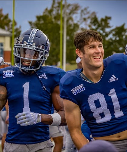 Two Georgia Southern University football players after a game
